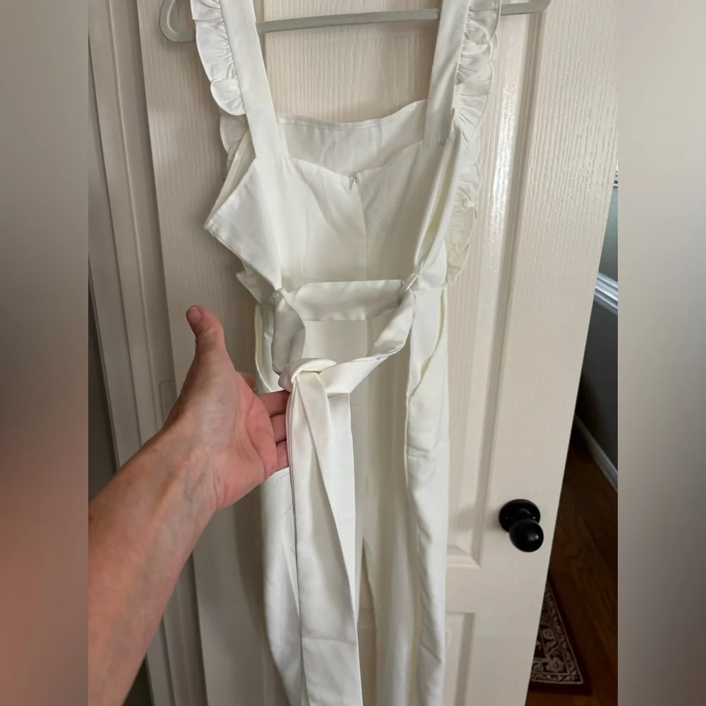 New without tags off-white jumpsuit. Size medium.‎